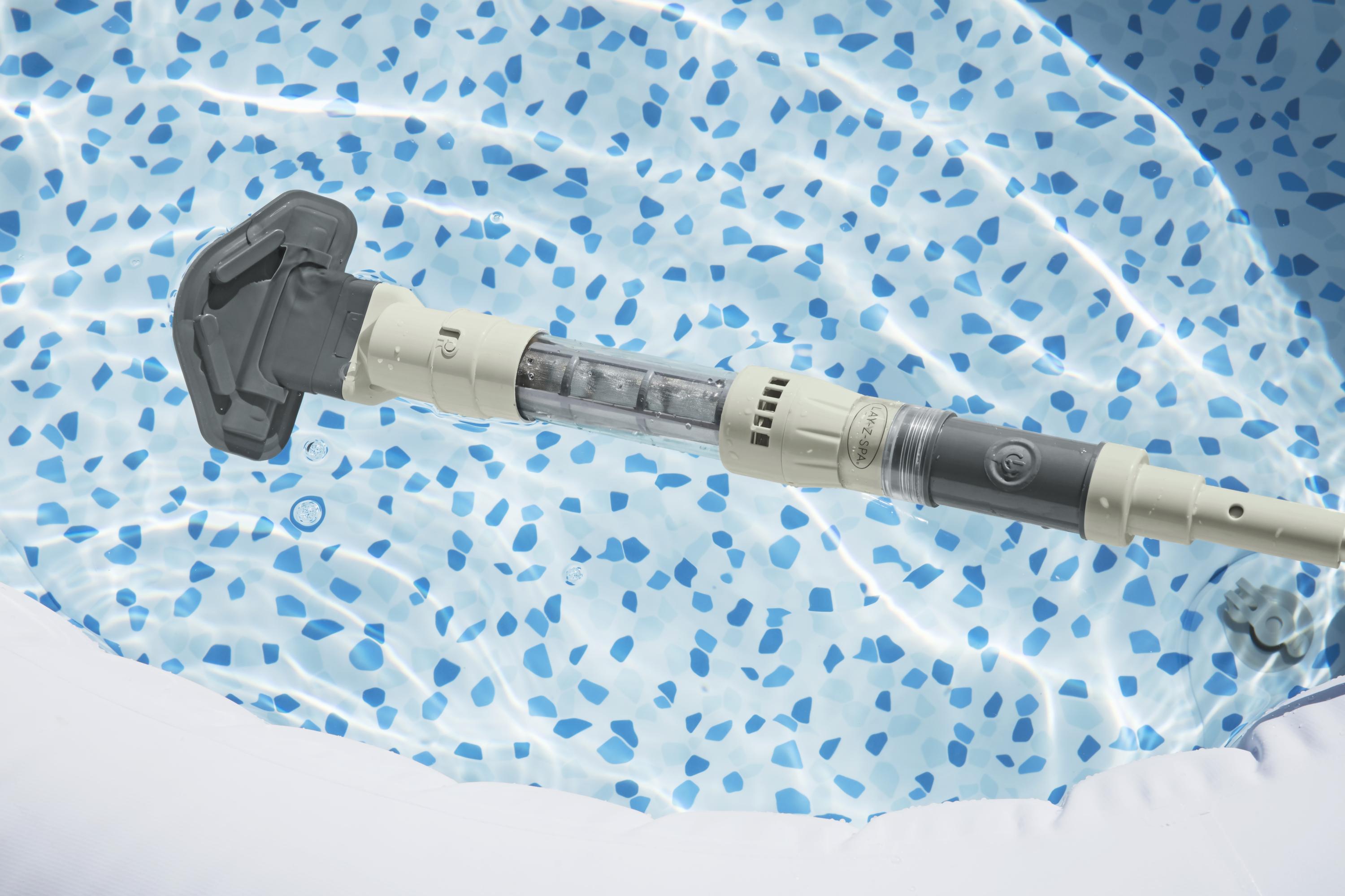 A close-up of the SaluSpa Rechargeable Cordless Underwater Hot Tub Vacuum in the water of a SaluSpa inflatable hot tub.